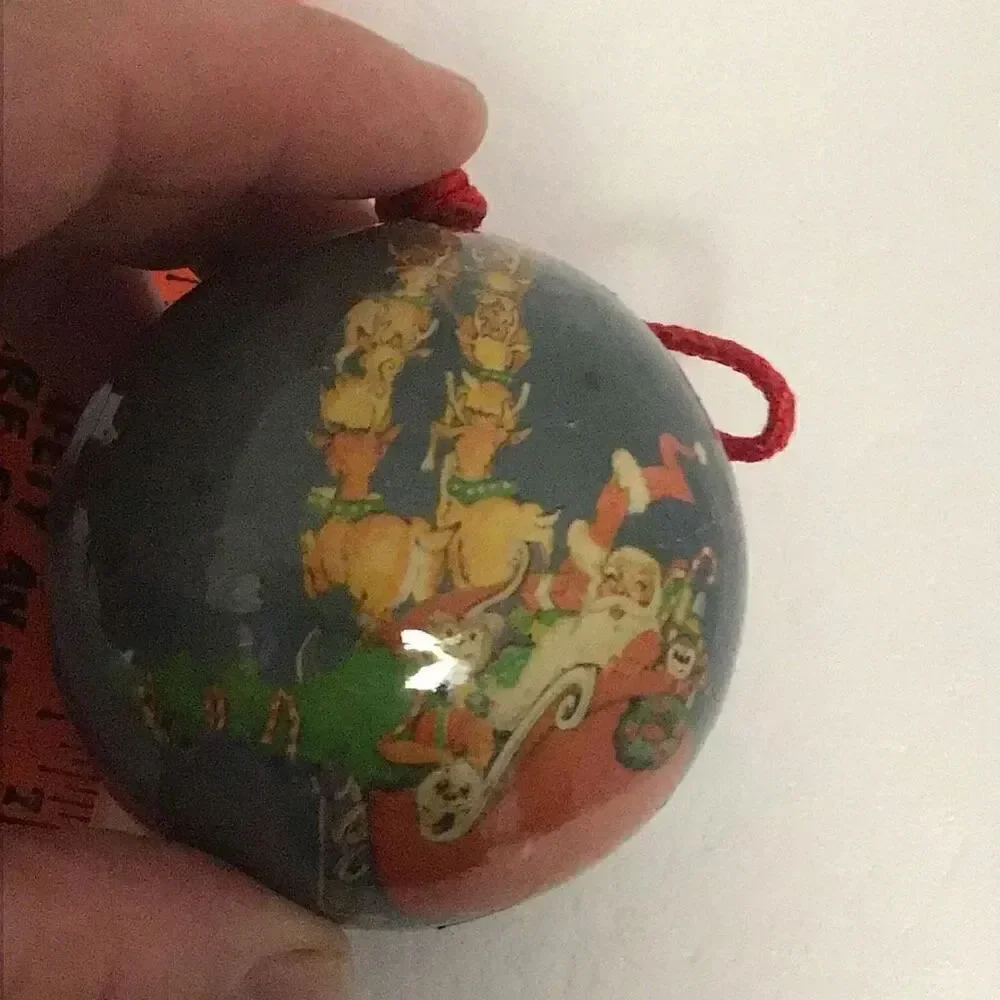 Pair of vintage paper ball Santa Christmas ornaments